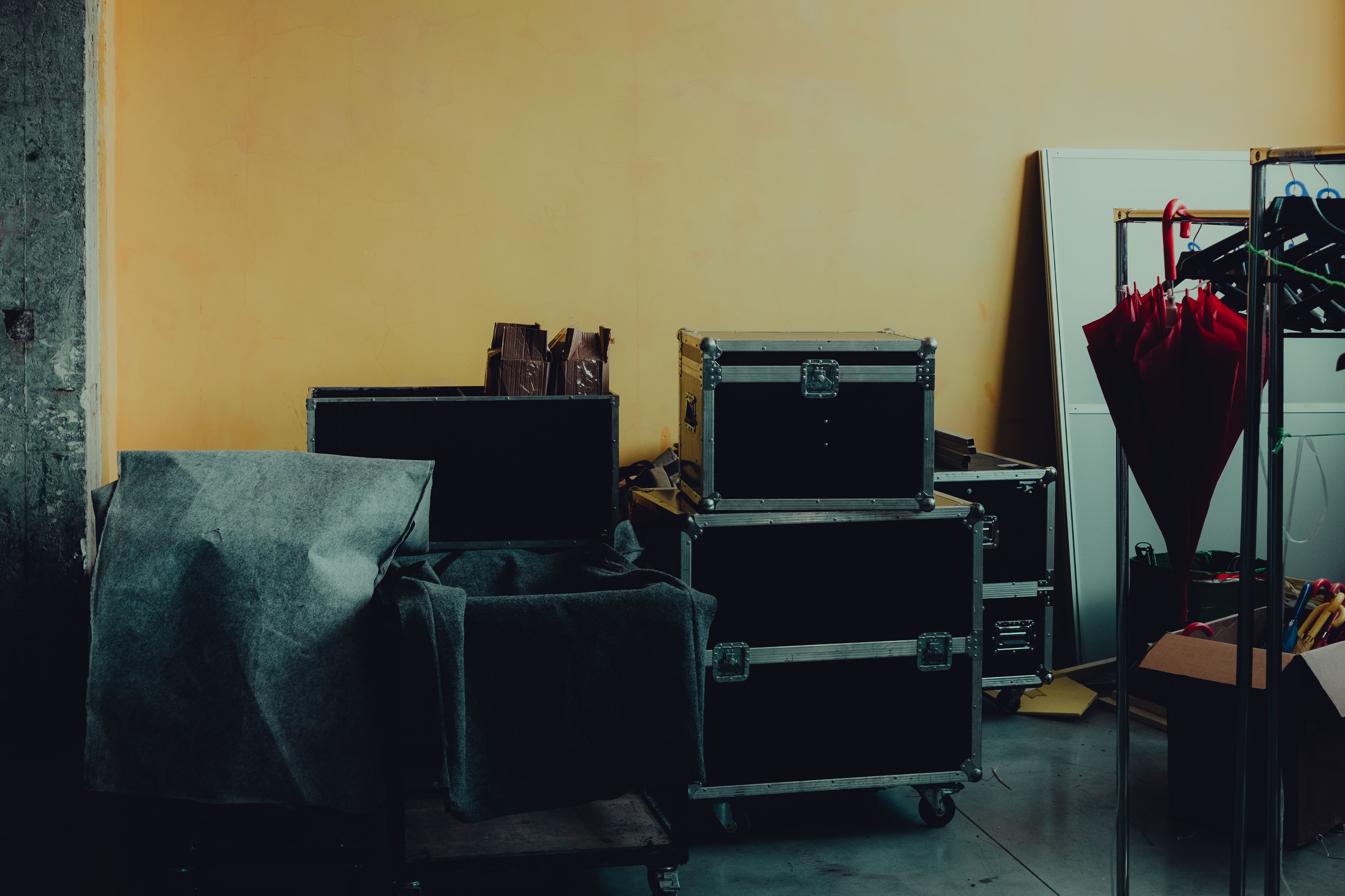 Many stacked cardboard boxes and storage cases filling a room during a basement or estate cleanout